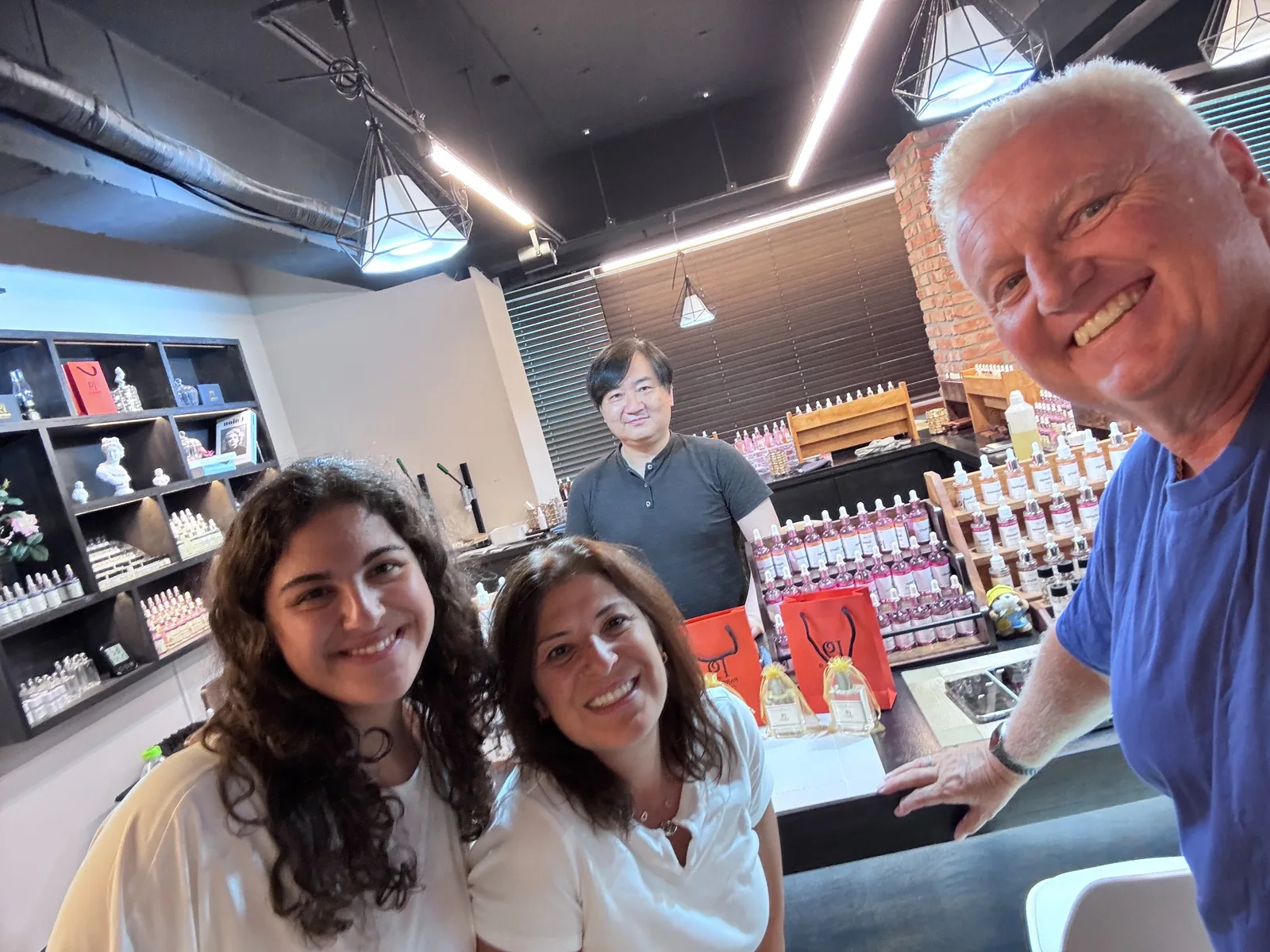 Family taking a photo after making perfume together in Hongdae Seoul