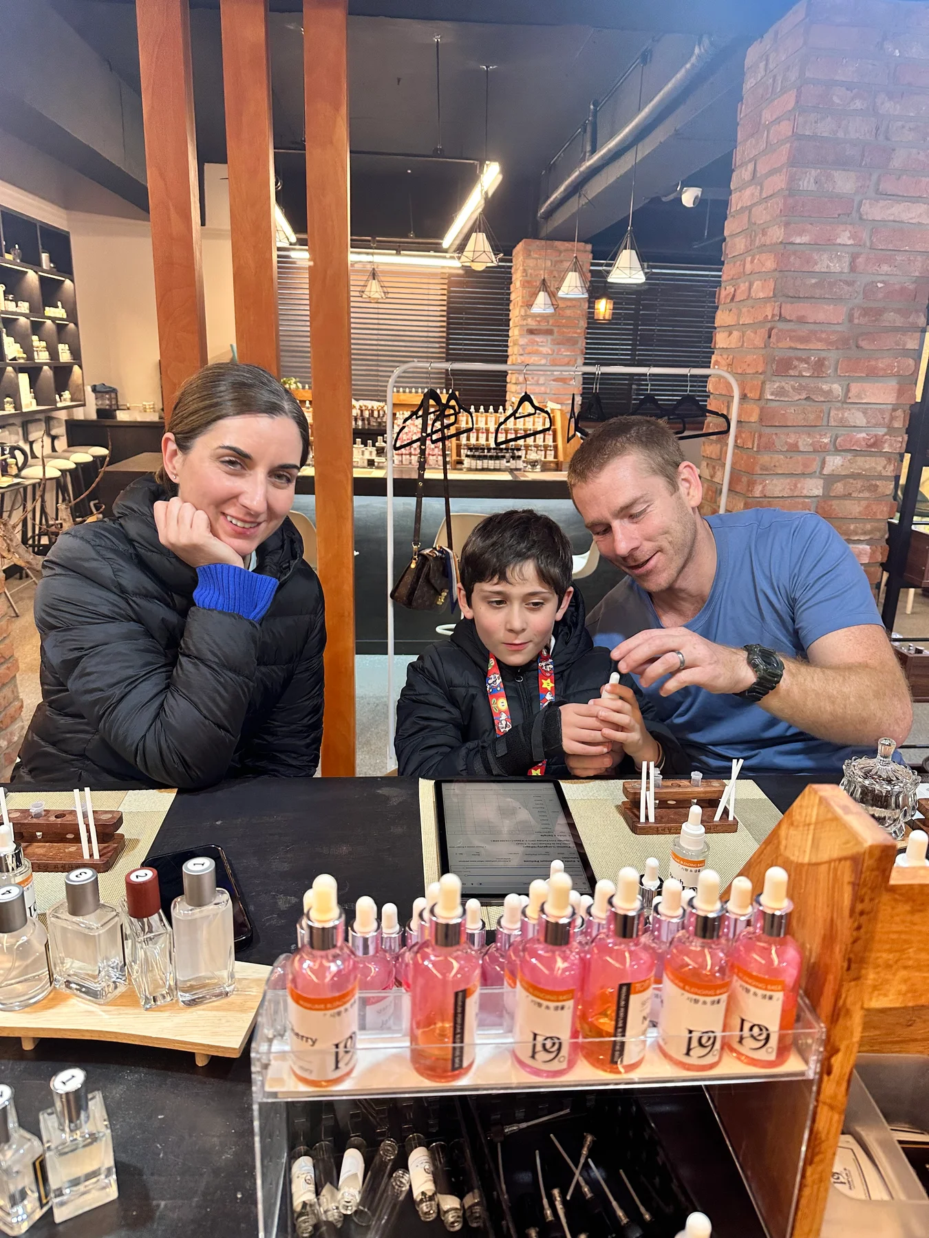 A family exploring fragrance notes at Parfum9 in Hongdae